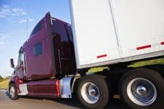 Photo of Semi Truck Driving on the Highway