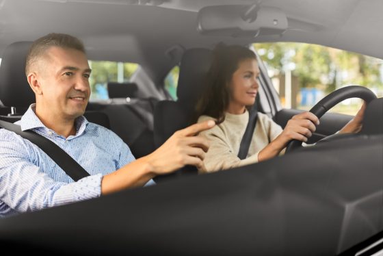 couple in car driving with car insurance