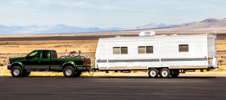 A truck pulling a travel trailer