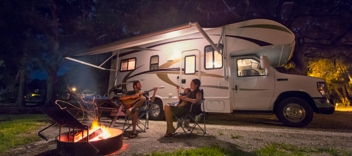 Person sitting outside of an RV