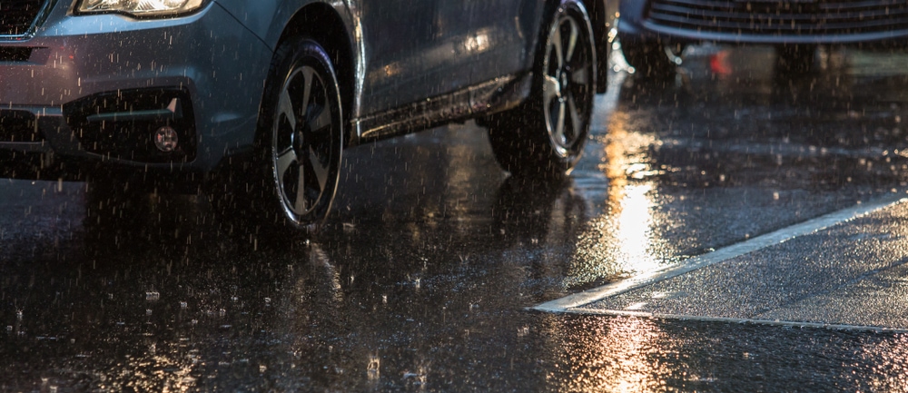 car driving on wet road in rain