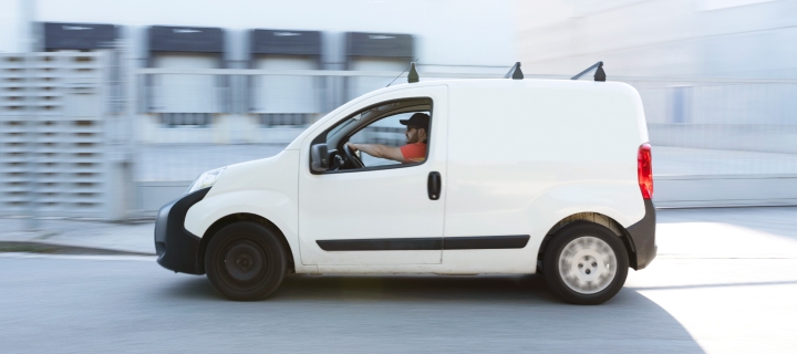 White van with driver inside